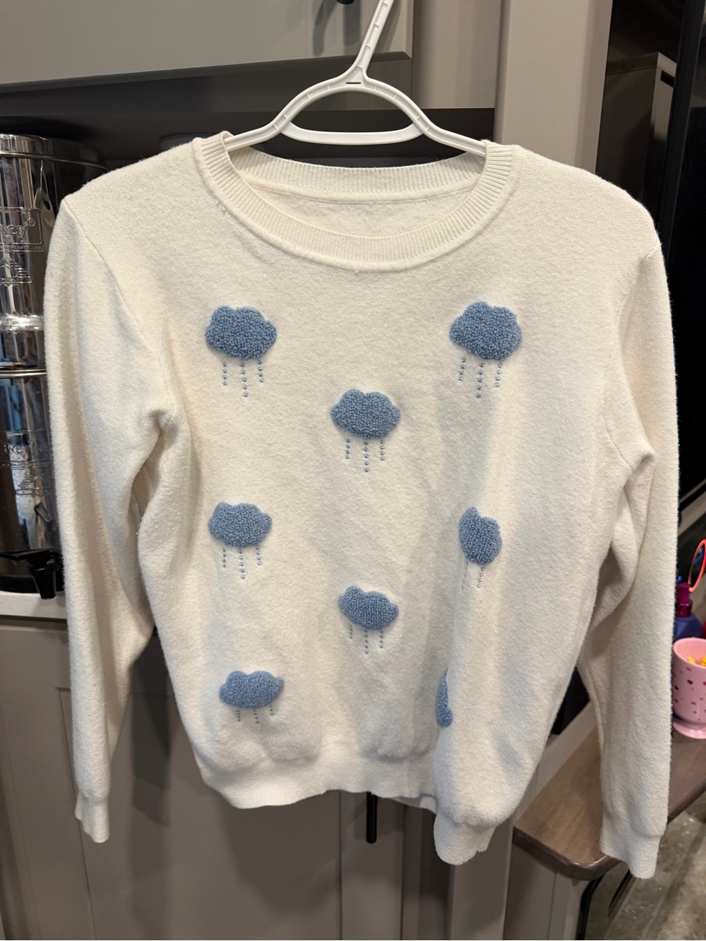 Cream Crewneck Sweater with Blue Cloud Appliqués